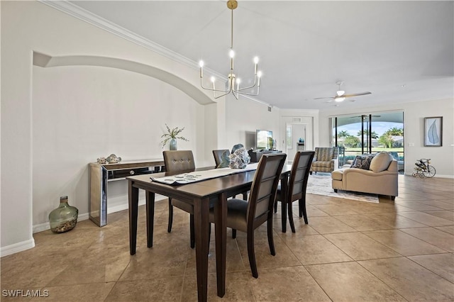 dining room featuring ornamental molding, ceiling fan with notable chandelier, baseboards, and light tile patterned floors