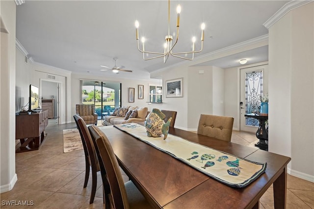 tiled dining room with ceiling fan with notable chandelier, baseboards, visible vents, and crown molding