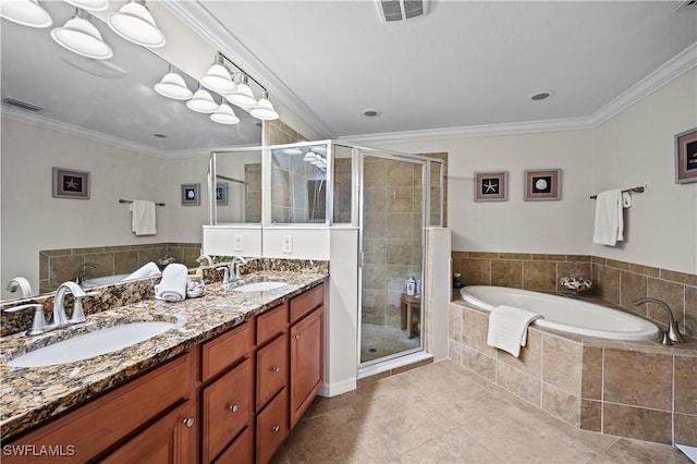 bathroom featuring crown molding, visible vents, and a sink