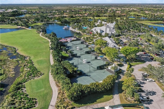 aerial view with a residential view, a water view, and golf course view