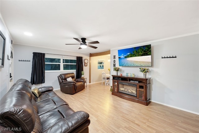 living room featuring hardwood / wood-style flooring and ceiling fan