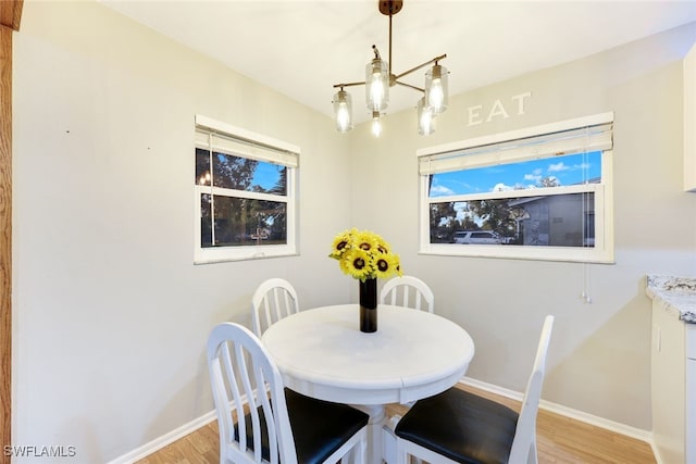 dining area with light hardwood / wood-style flooring