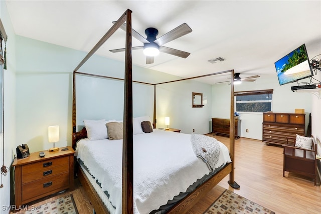 bedroom with ceiling fan and light hardwood / wood-style flooring