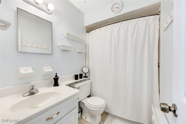 bathroom featuring tile patterned flooring, vanity, a shower with shower curtain, and toilet