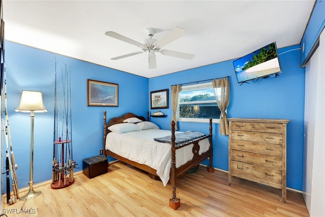 bedroom with hardwood / wood-style floors and ceiling fan