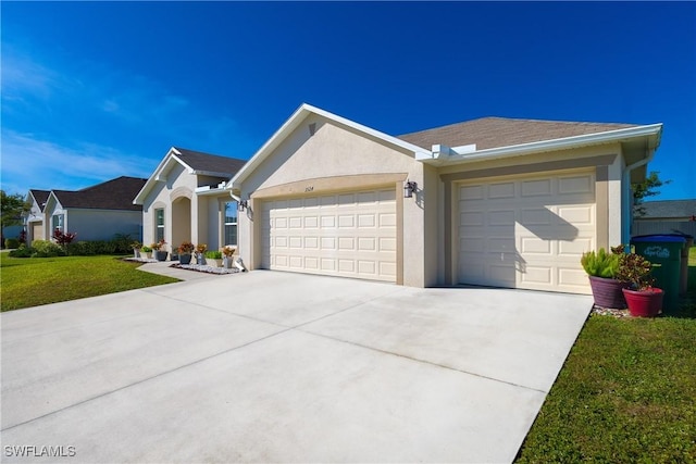 ranch-style house with a garage and a front yard