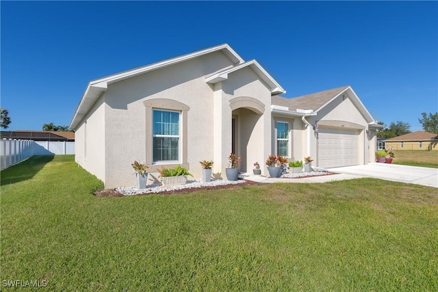 view of front of house featuring a front lawn and a garage