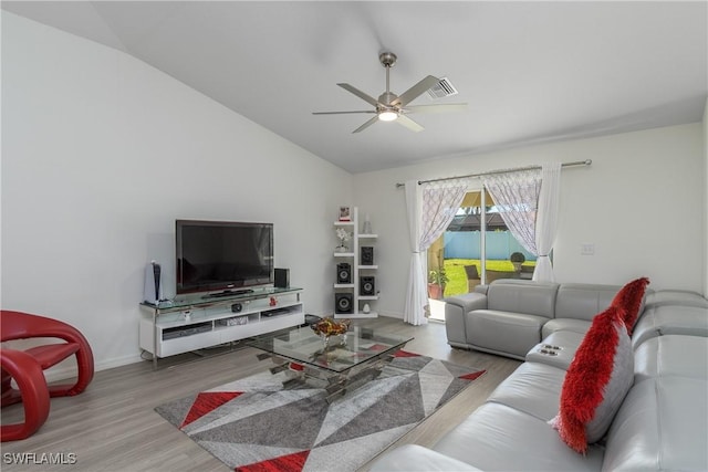 living room featuring light wood-type flooring, vaulted ceiling, and ceiling fan