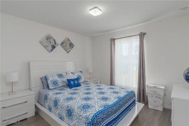 bedroom featuring light wood-type flooring