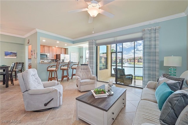 living room with ceiling fan, light tile patterned flooring, and crown molding