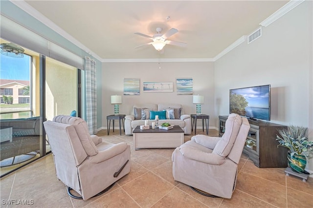 tiled living room with ceiling fan and ornamental molding