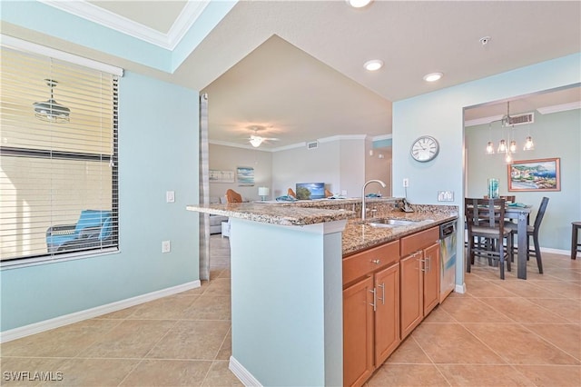 kitchen featuring light tile patterned flooring, ornamental molding, stainless steel dishwasher, light stone counters, and sink