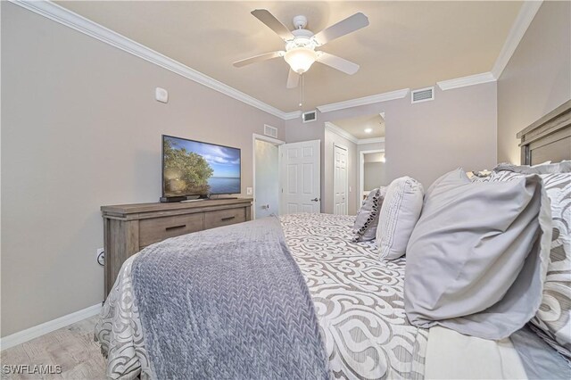 bedroom with ceiling fan and ornamental molding