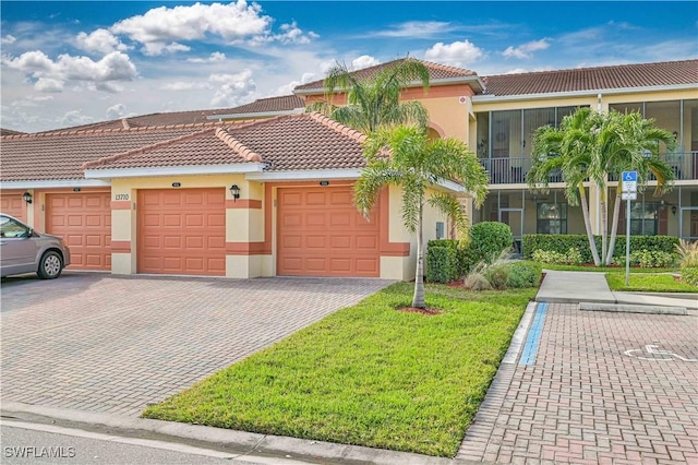 view of front of house with a front lawn and a garage