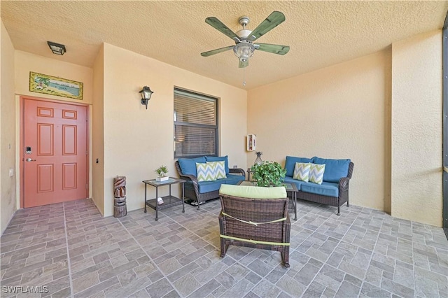 view of patio featuring ceiling fan and an outdoor living space