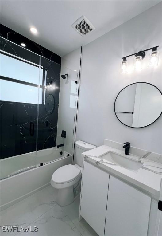 full bathroom with toilet, vanity, and combined bath / shower with glass door