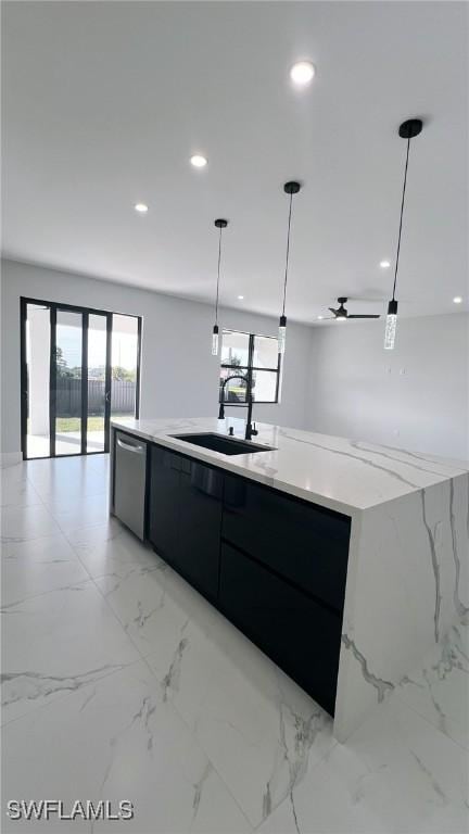 kitchen with ceiling fan, dishwasher, sink, hanging light fixtures, and a large island with sink