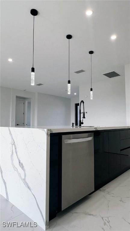 kitchen featuring stainless steel dishwasher, decorative light fixtures, and sink