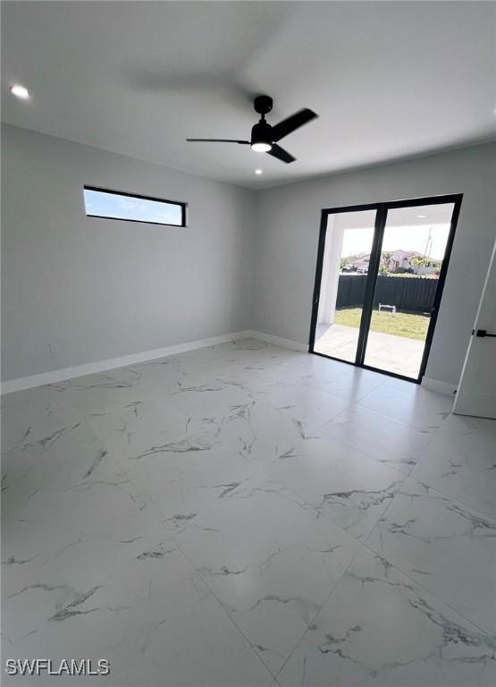 spare room featuring ceiling fan