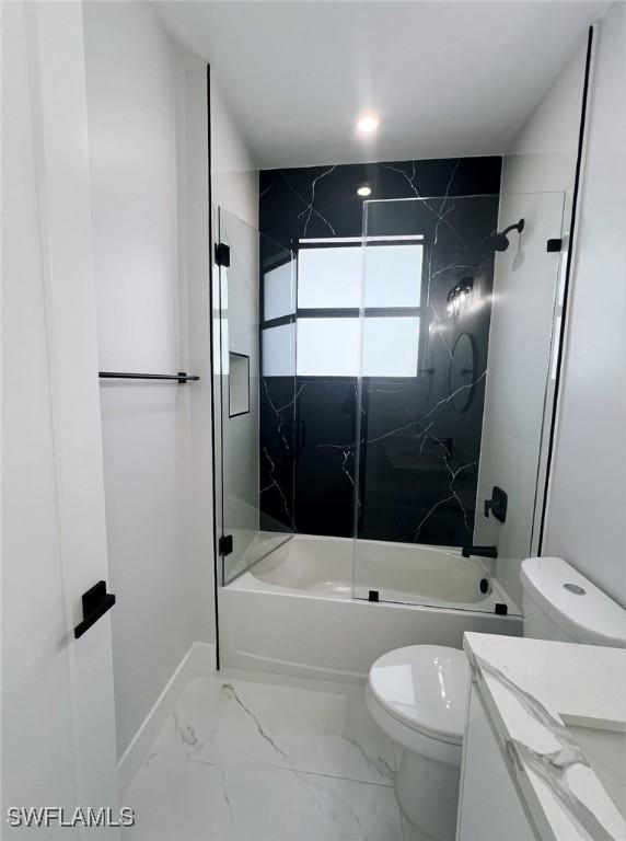 full bathroom with vanity, toilet, and tiled shower / bath