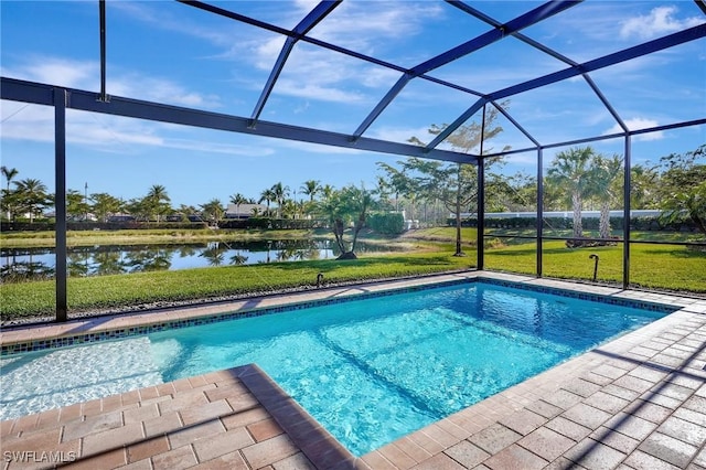 view of swimming pool with a patio, a water view, glass enclosure, and a lawn