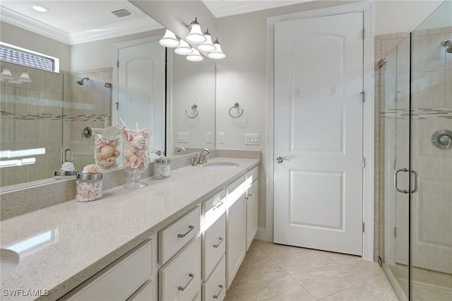 bathroom featuring vanity, an enclosed shower, and ornamental molding