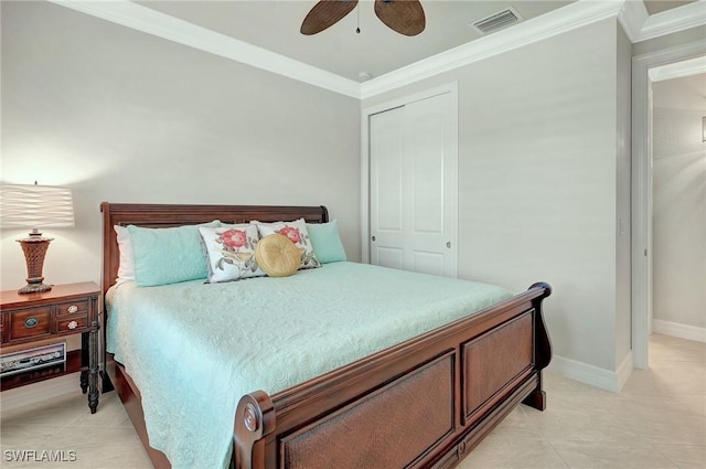 tiled bedroom featuring ceiling fan, a closet, and crown molding