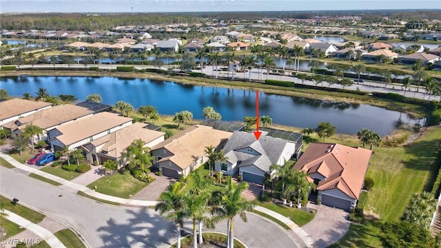 birds eye view of property featuring a water view