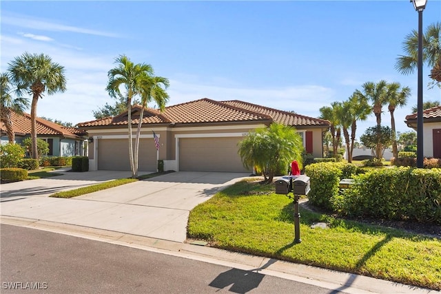 mediterranean / spanish house with a garage