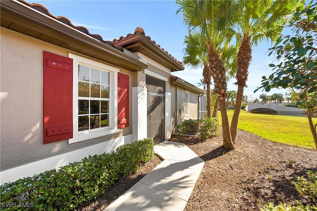 entrance to property with a yard