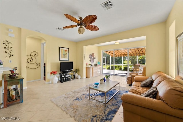 living room featuring ceiling fan and light tile patterned floors