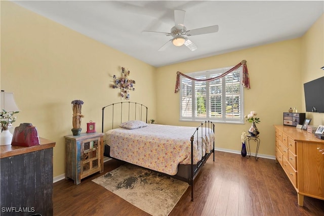 bedroom featuring ceiling fan and dark wood-type flooring