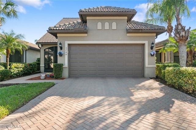 mediterranean / spanish-style home featuring a garage