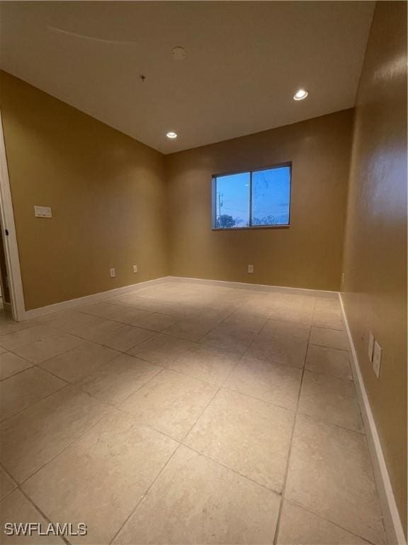 empty room with light tile patterned floors