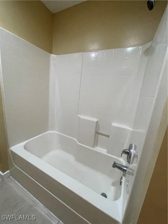 bathroom with  shower combination and tile patterned floors