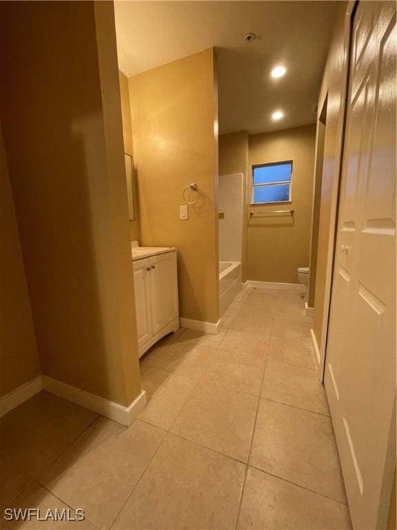 full bathroom featuring tile patterned floors, vanity, shower with separate bathtub, and toilet