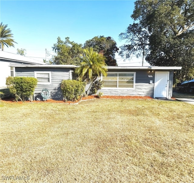 single story home with a front yard