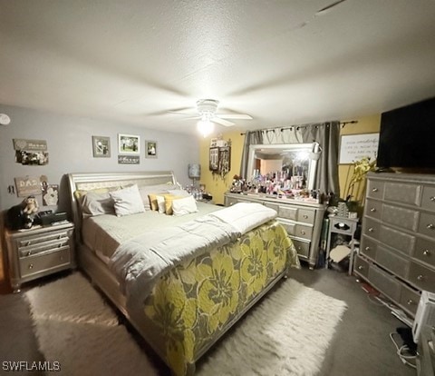 bedroom featuring dark carpet and ceiling fan