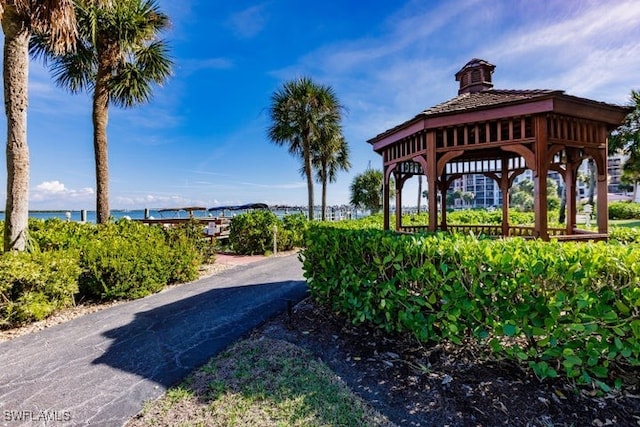 view of home's community with a gazebo and a water view