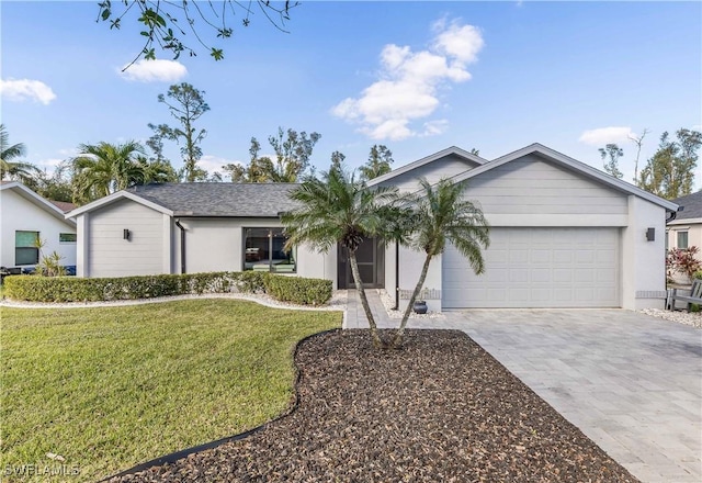 ranch-style house with a garage and a front yard