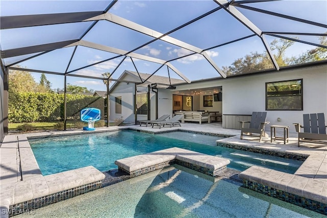 view of swimming pool with a lanai, an in ground hot tub, a patio, and an outdoor hangout area