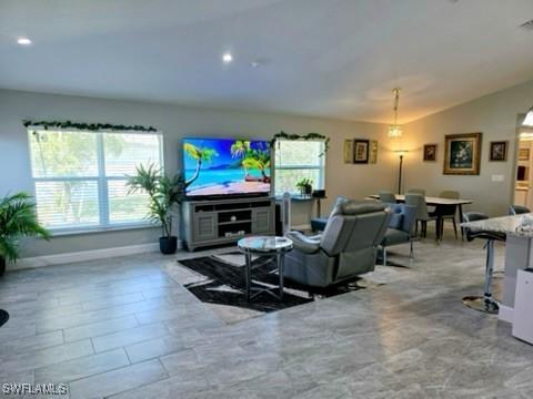 living room with lofted ceiling