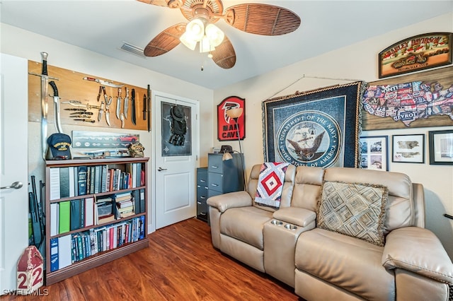 living room with hardwood / wood-style flooring and ceiling fan