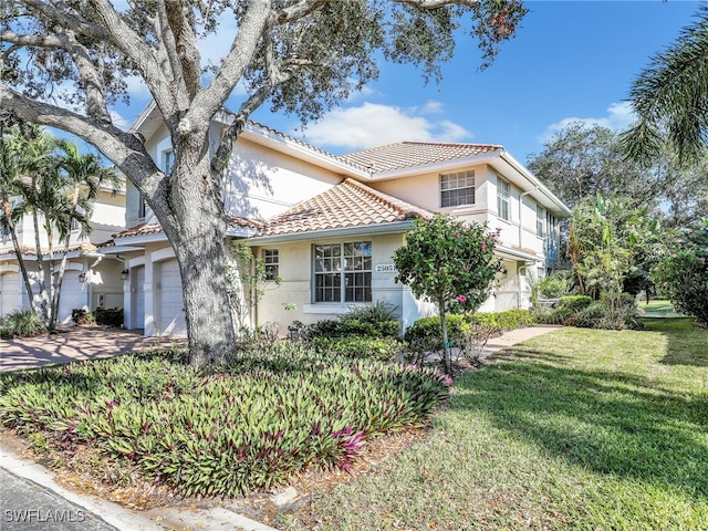 view of property exterior with a lawn and a garage