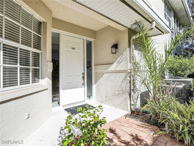 25051 Ballycastle Ct Unit 102, Bonita Springs, FL 34134 - entrance to property featuring stucco siding and crawl space