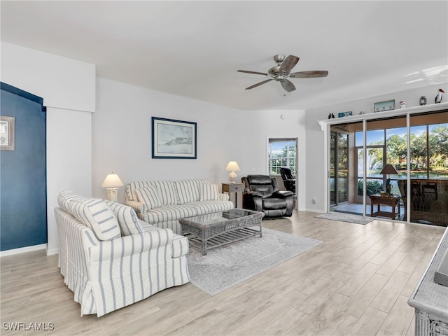 25051 Ballycastle Ct Unit 102, Bonita Springs, FL 34134 - living area with light wood-type flooring and a ceiling fan