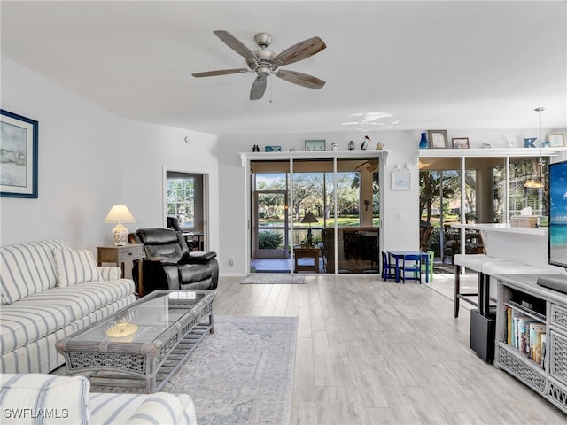 25051 Ballycastle Ct Unit 102, Bonita Springs, FL 34134 - living room with ceiling fan and wood finished floors