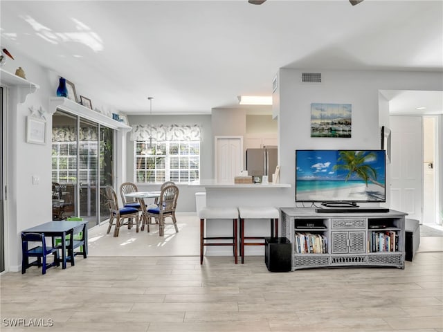 25051 Ballycastle Ct Unit 102, Bonita Springs, FL 34134 - living room featuring light wood-style floors and baseboards