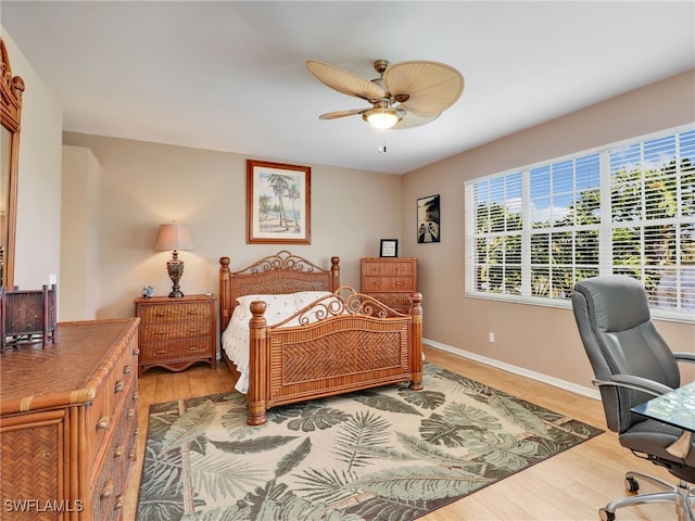 bedroom featuring ceiling fan and hardwood / wood-style flooring