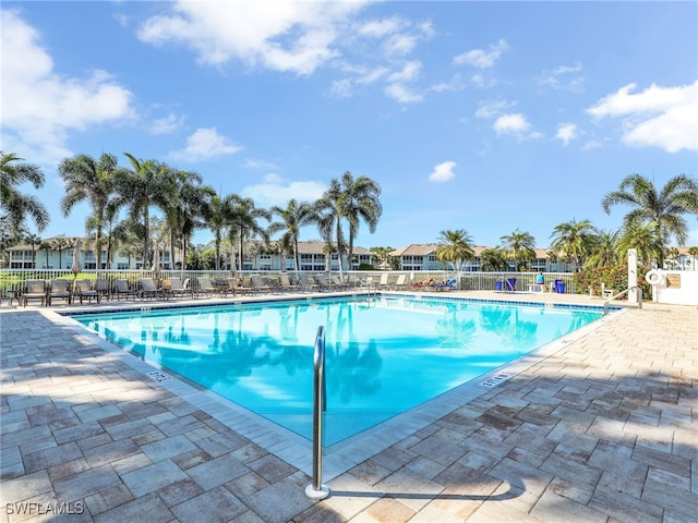 25051 Ballycastle Ct Unit 102, Bonita Springs, FL 34134 - community pool featuring a patio